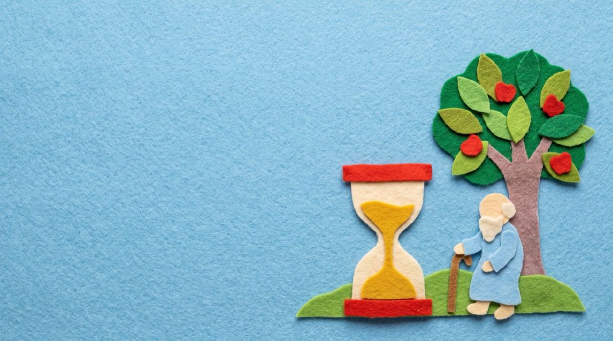 Felt hourglass, an apple tree, and an old man leaning on a staff