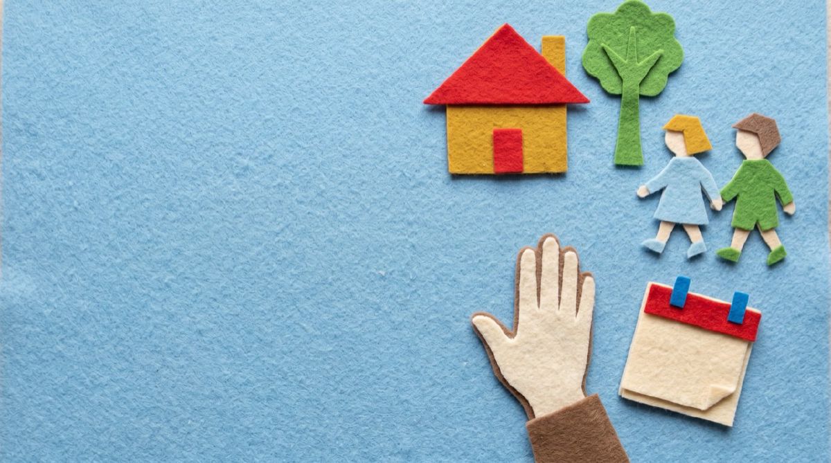Felt house, a family, and a wall calendar